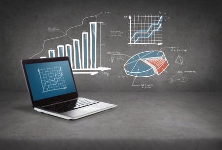 Laptop with graphic of statistical information.