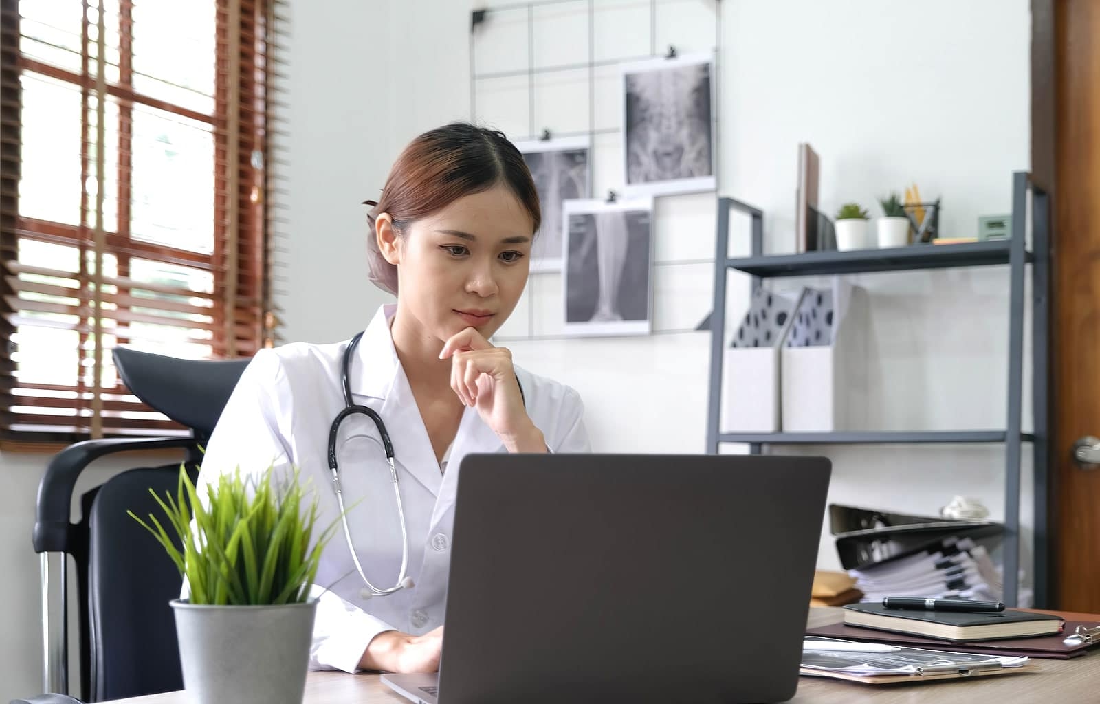 Image of a doctor working on a laptop on Dragonfly Digital Marketing's website