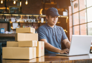 Image of a man writing product descriptions for an eCommerce website