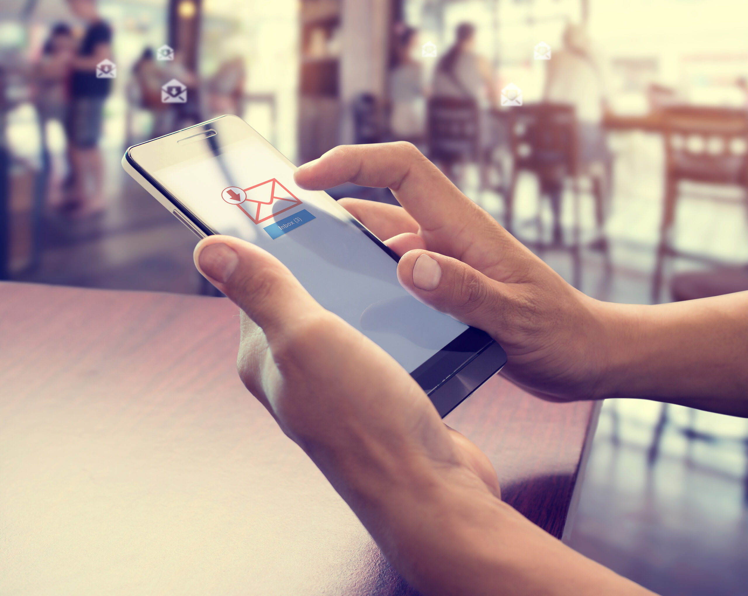 Image of a man opening an email on a tablet