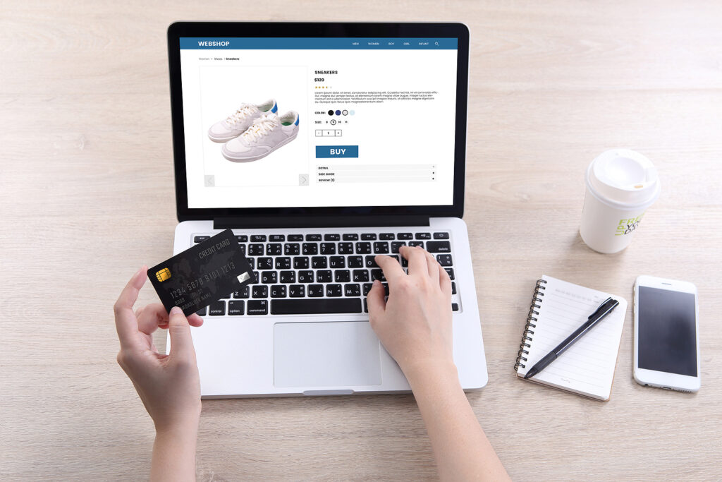 Image of a person using a laptop to make an online purchase