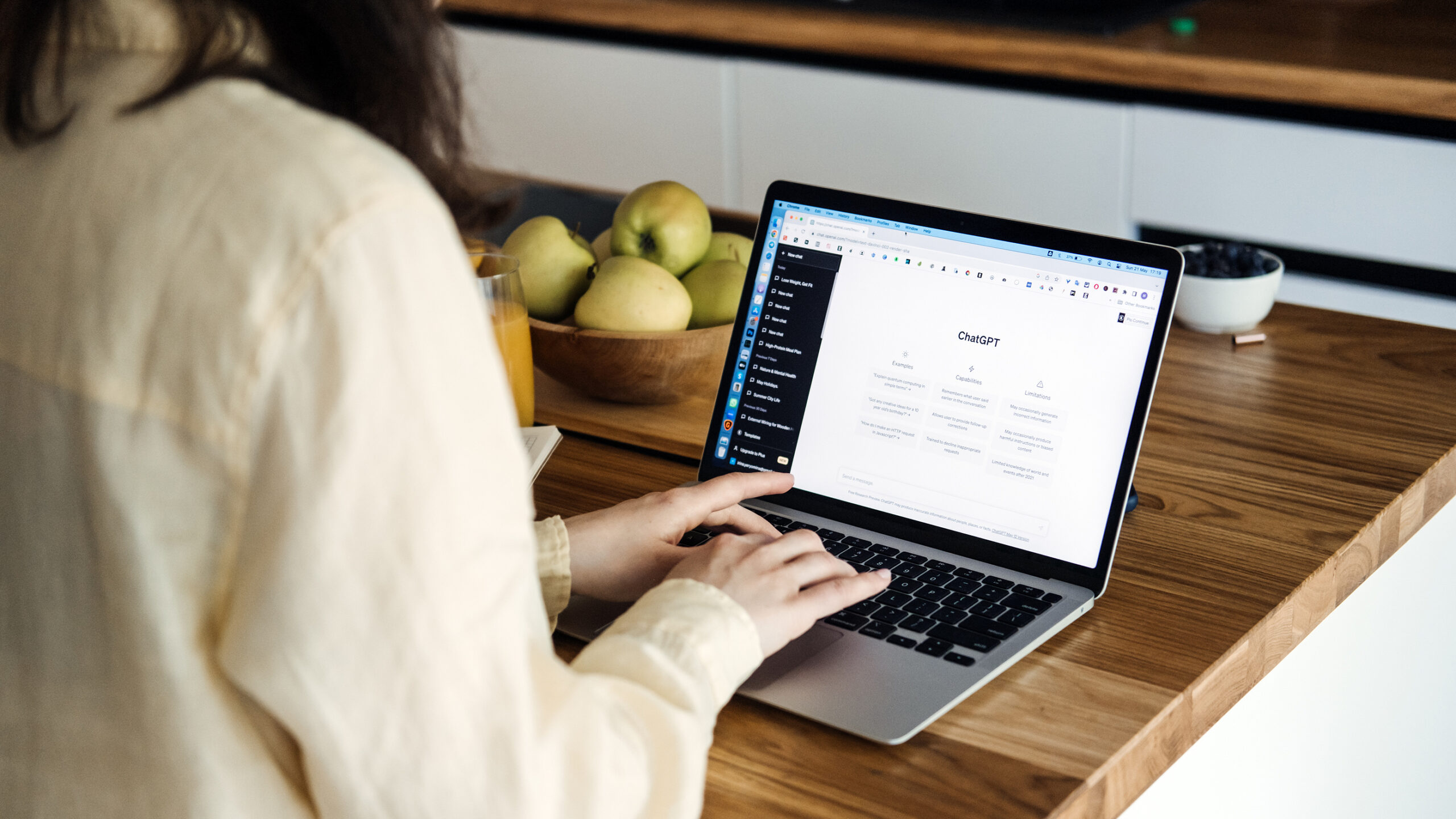 Image of a woman using ChatGPT on a laptop