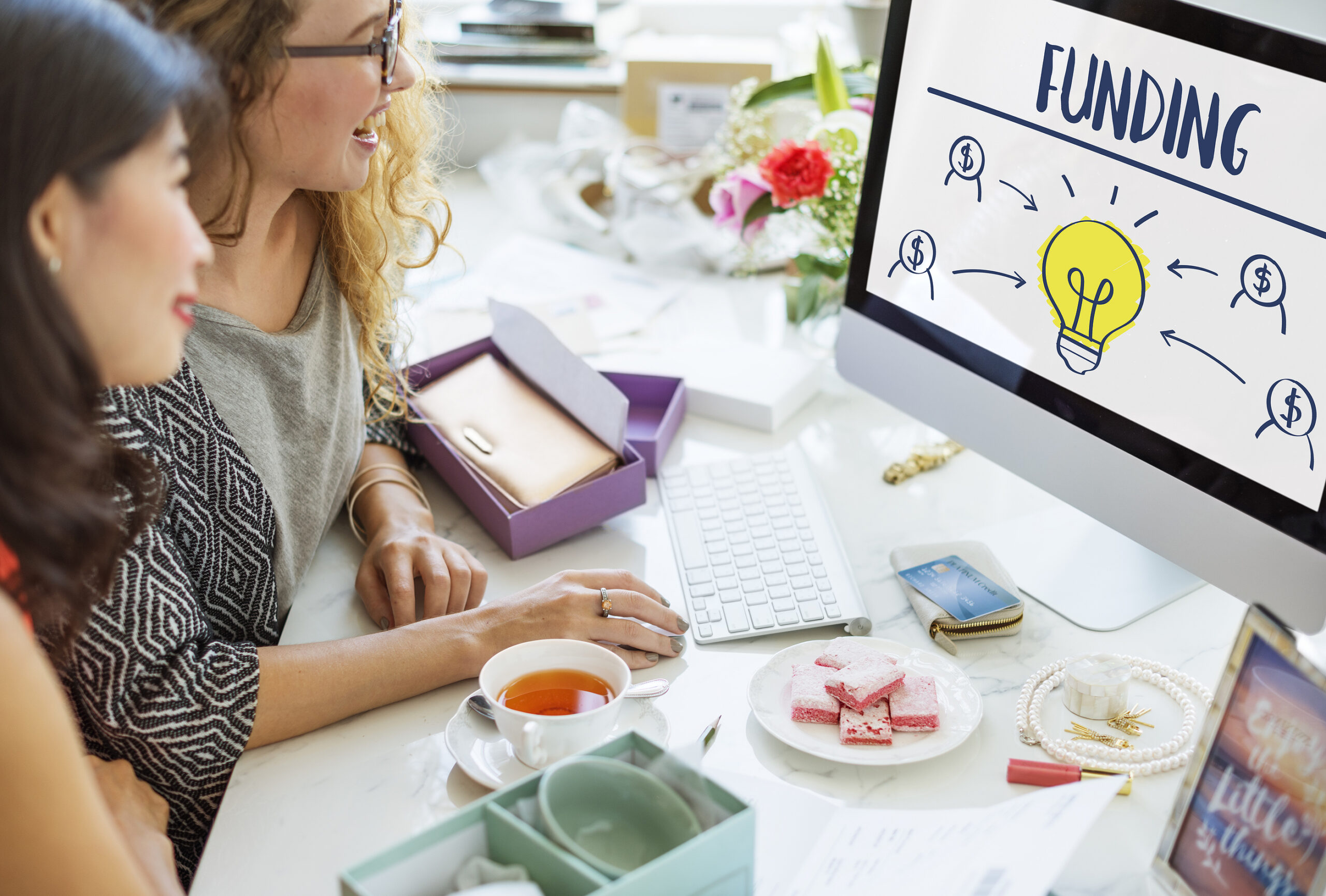 Women using a computer at a desk